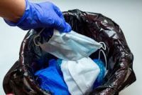 ppe disposed in garbage
